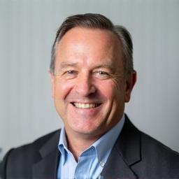 Professional headshot of Ravi Sharma, a man smiling